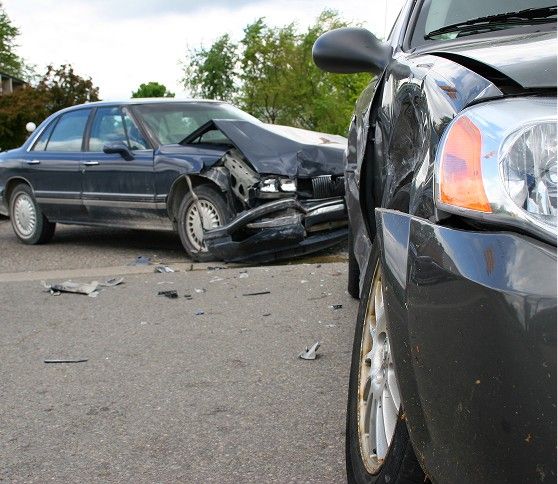 Serious Car Accident Scene Two cars involved in a serious collision on a road.